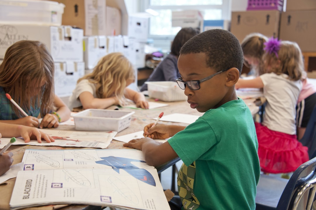Students learning together in a bright school classroom